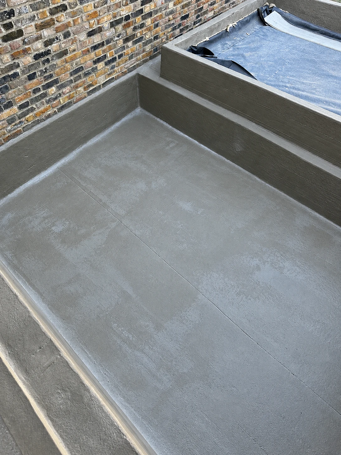 KÖSTER waterproof barrier detailing around pool steps, corners and changes of level