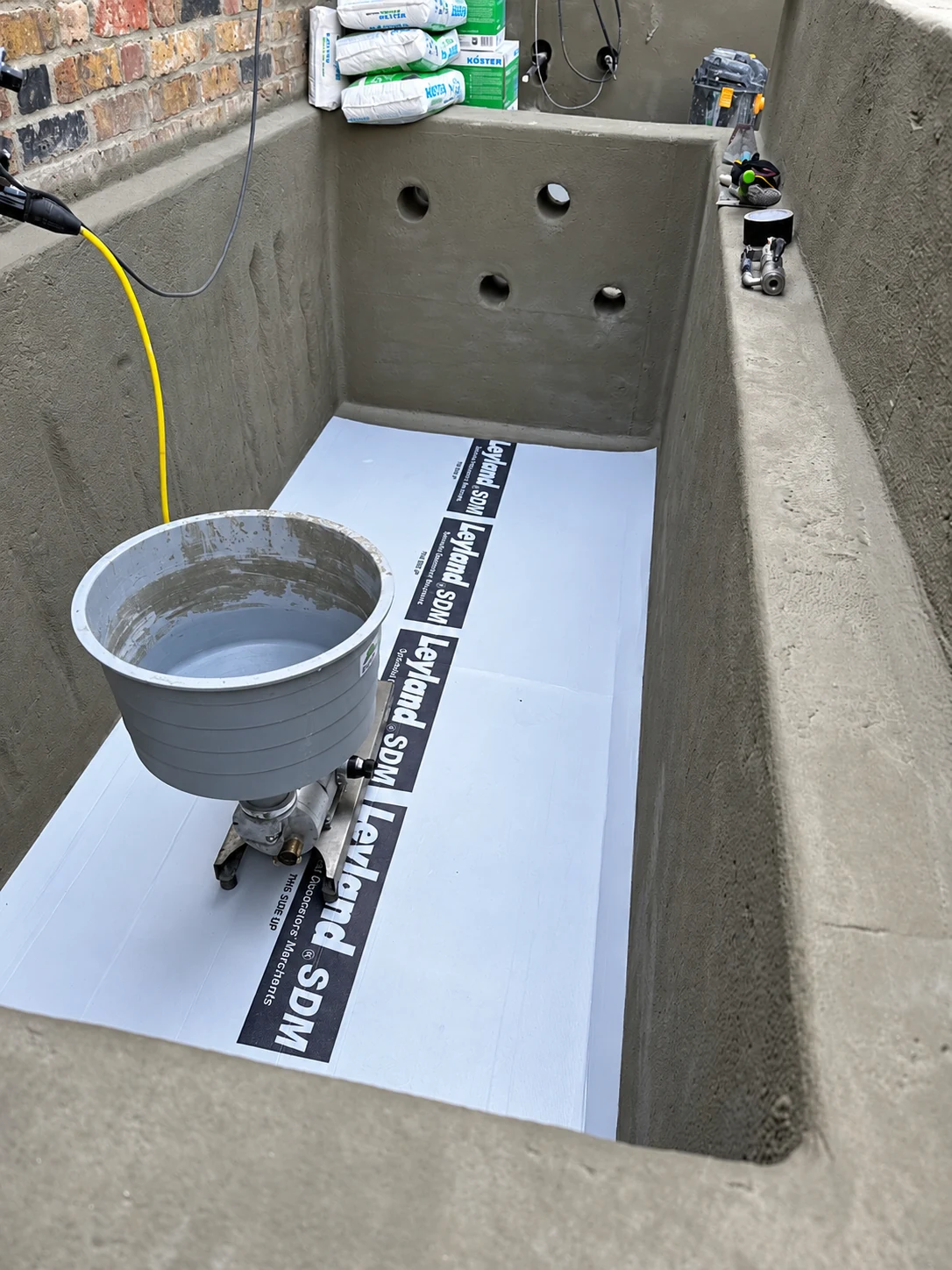 KÖSTER waterproofing works with KÖSTER materials visible on site