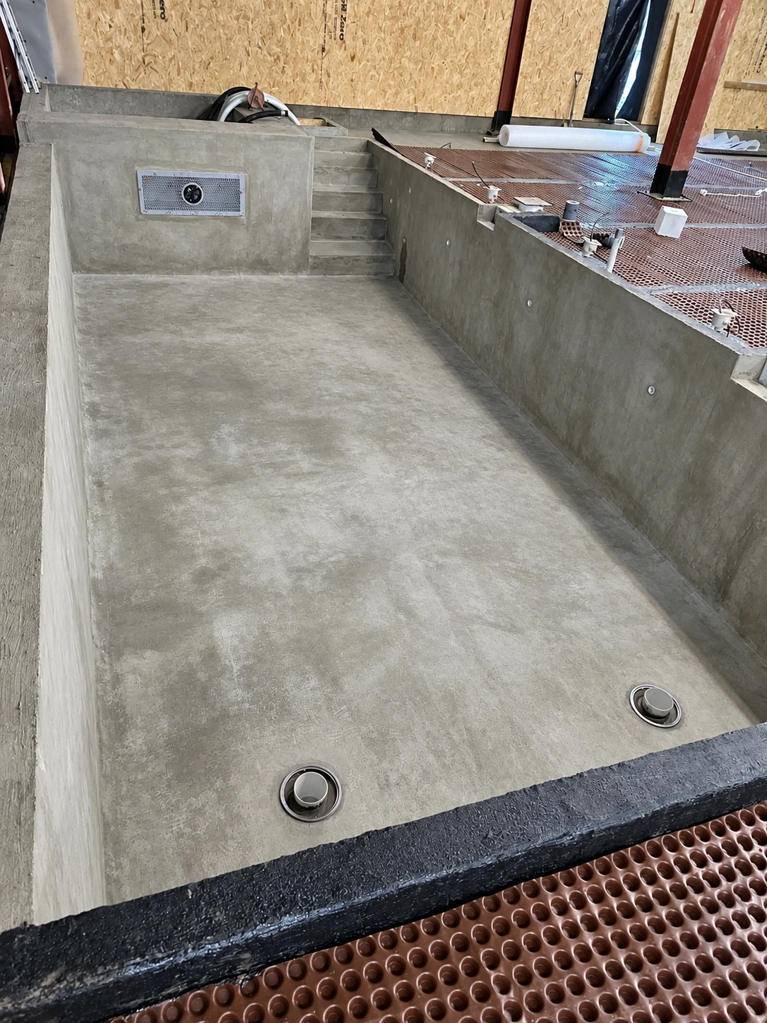 Detailed view inside a waterproofed swimming pool shell