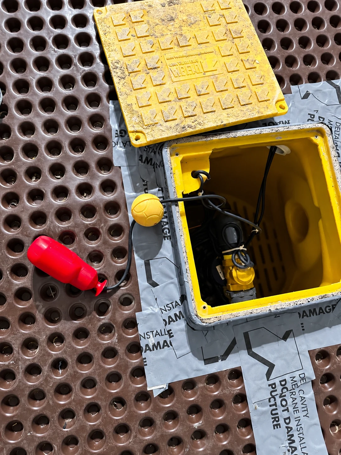 Open pump chamber showing service components and level controls